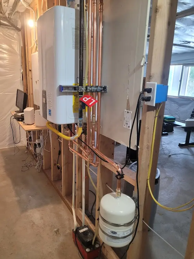 Licensed plumber repairing a kitchen sink in Kaiminani